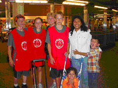 Elvie, PJ and Abigail standing with four teenaged members of a prayer team