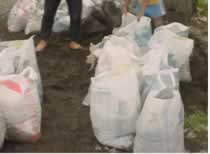 Sacks filled with gravel.