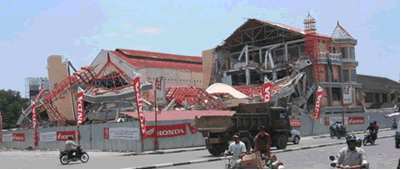 Damaged shooping mall on busy street