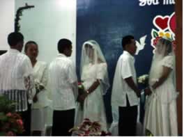 Three couples exchanging vows.